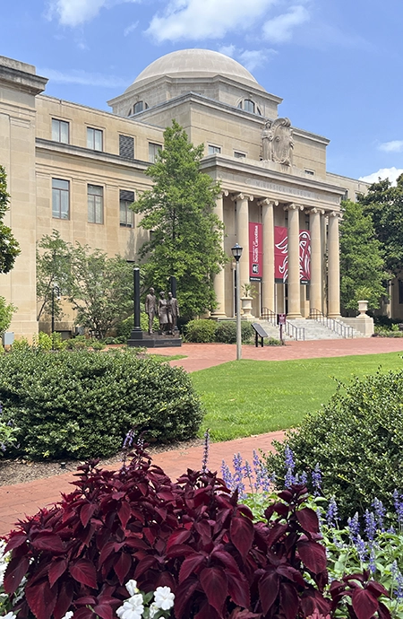 The beautiful McKissick Museum with large columns and banners. 