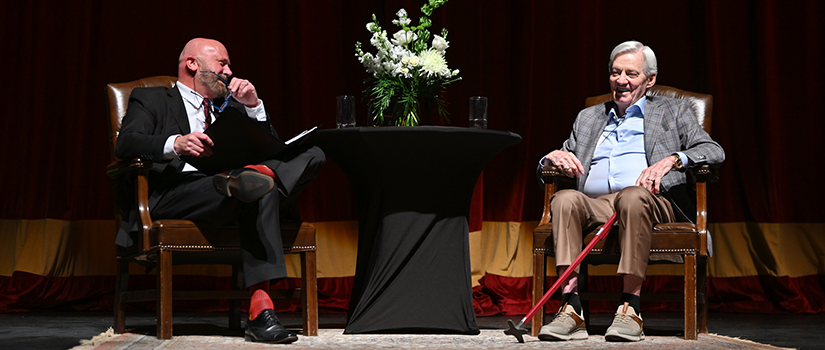 Fame Virginia Tech head coach Frank Beamer speaking on stage at the event. 