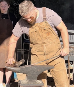Professor Thomas Bosse giving a blacksmithing demonstration