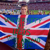 Eveie Robinson holding a University of Leeds flag