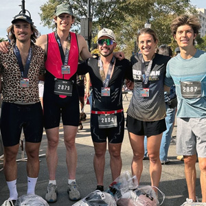 group of people in workout clothes with competitor numbers around their necks
