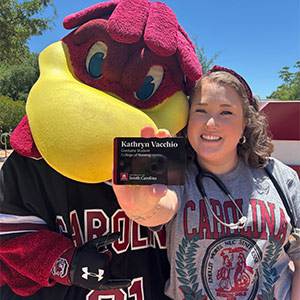 Kathryn Vacchio stands with Cocky.